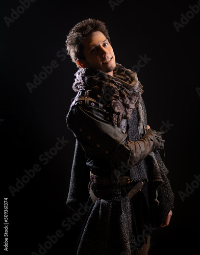 A guy in a steampunk or post-apocalyptic image, portrait on a black background © Ulia Koltyrina