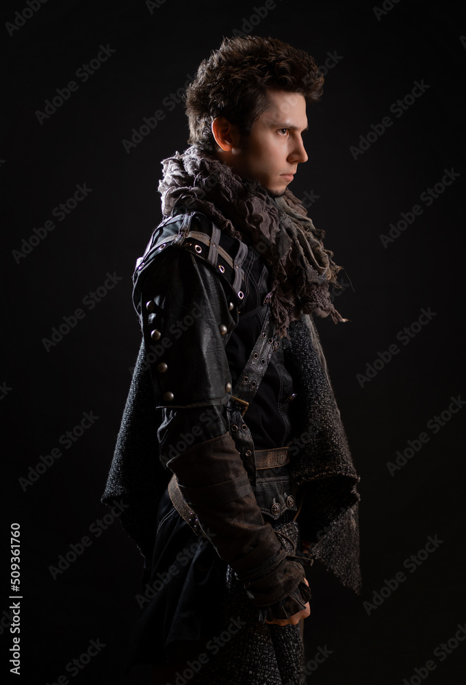 A guy in a steampunk or post-apocalyptic image, portrait on a black background A guy in a steampunk or post-apocalyptic image, portrait on a black background