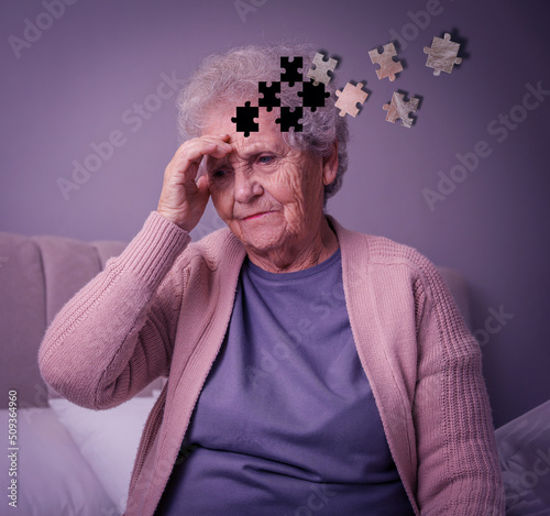 Elderly woman suffering from dementia at home. Illustration of head as jigsaw puzzle losing pieces photo