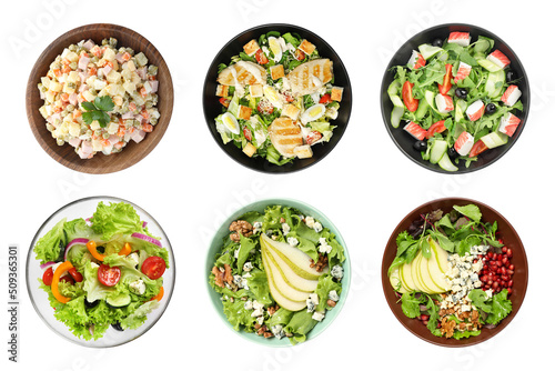 Set with different tasty salads on white background, top view