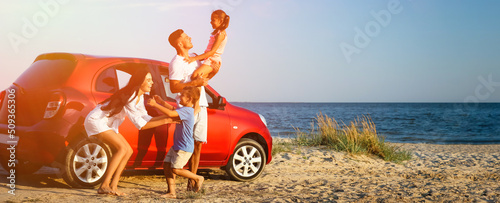 Canvas Print Happy family having fun near car on sandy beach. Banner design