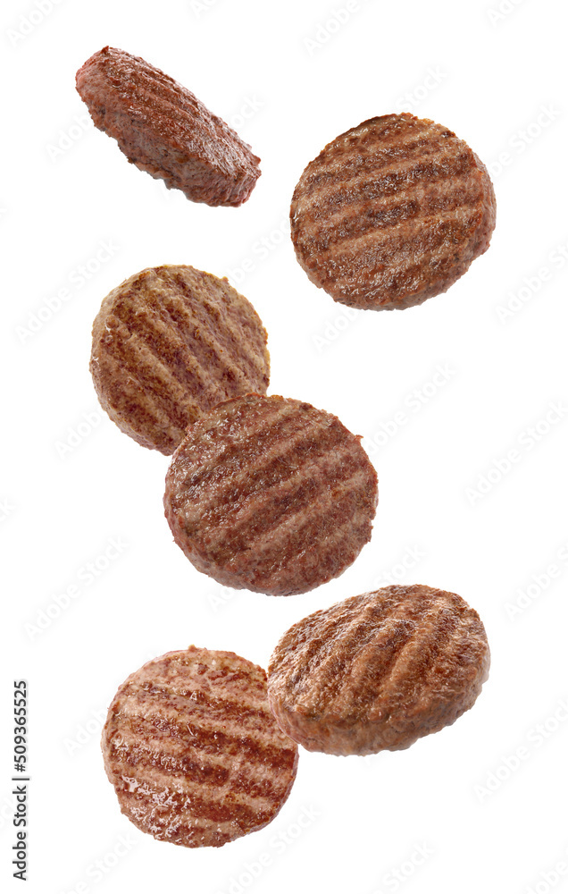 Tasty grilled hamburger patties falling on white background Tasty grilled hamburger patties falling on white background