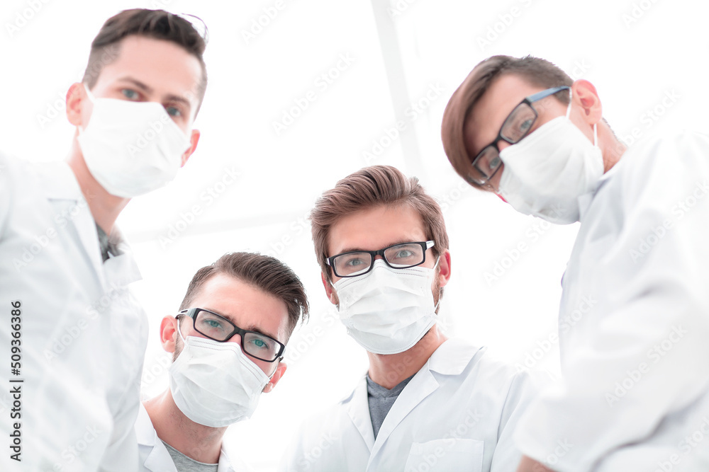 closeup.a serious group of doctors closeup.a serious group of doctors