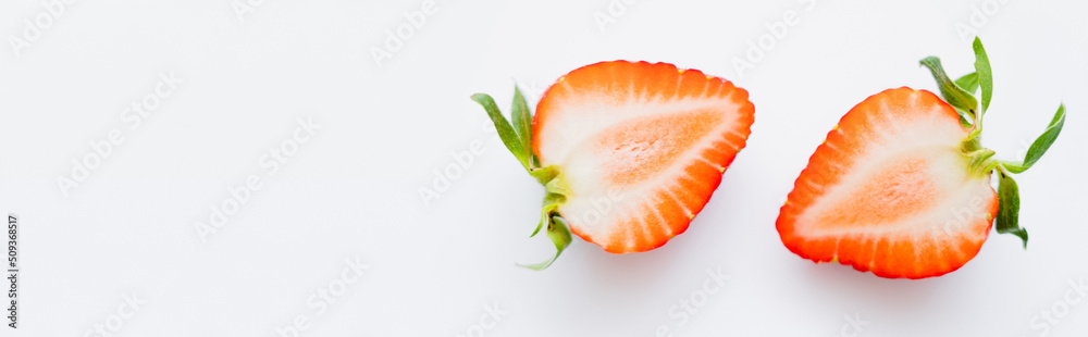 Close up view of juicy cut strawberry on white background, banner. Close up view of juicy cut strawberry on white background, banner.