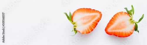 Close up view of juicy cut strawberry on white background, banner.