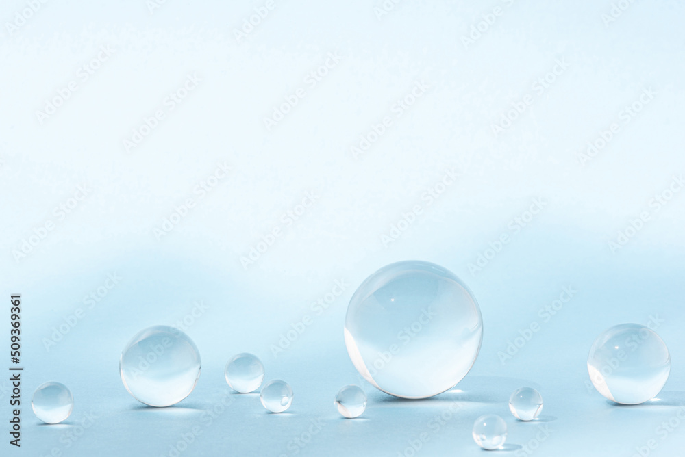 Blue background with transparent glass balls.