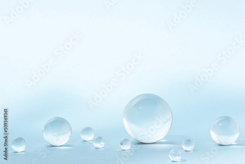 Blue background with transparent glass balls.