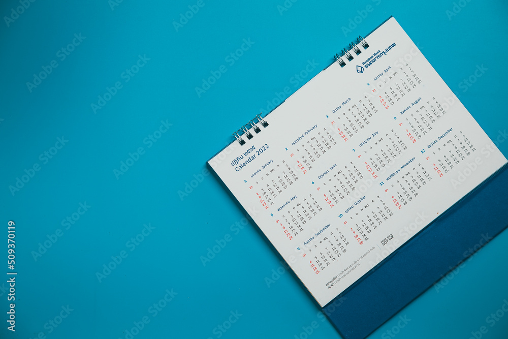 Close top view on white calendar 2022 month schedule Work planning and life concept. Close top view on white calendar 2022 month schedule Work planning and life concept.