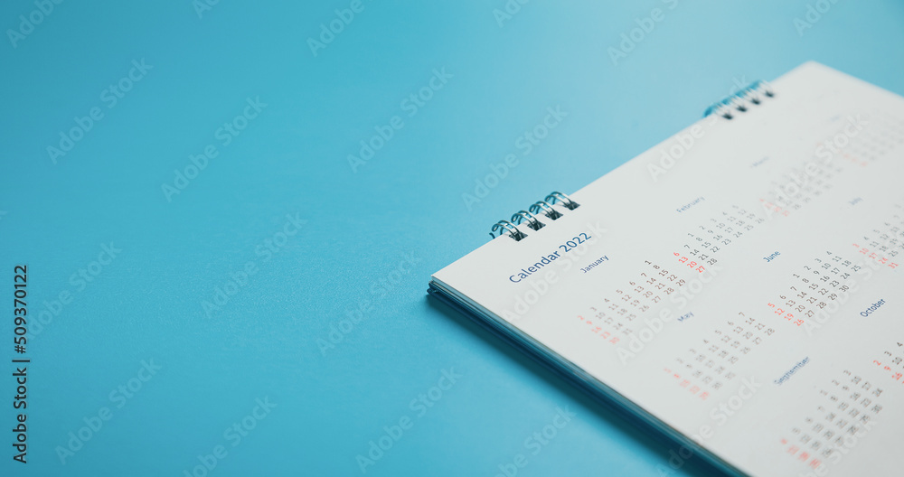 Close top view on white calendar 2022 month schedule Work planning and life concept. Close top view on white calendar 2022 month schedule Work planning and life concept.