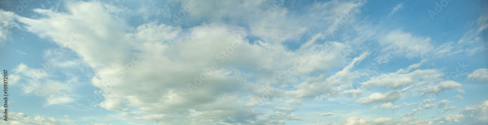 Peace scenic skyline background, clear blue sky with white clouds Peace scenic skyline background, clear blue sky with white clouds