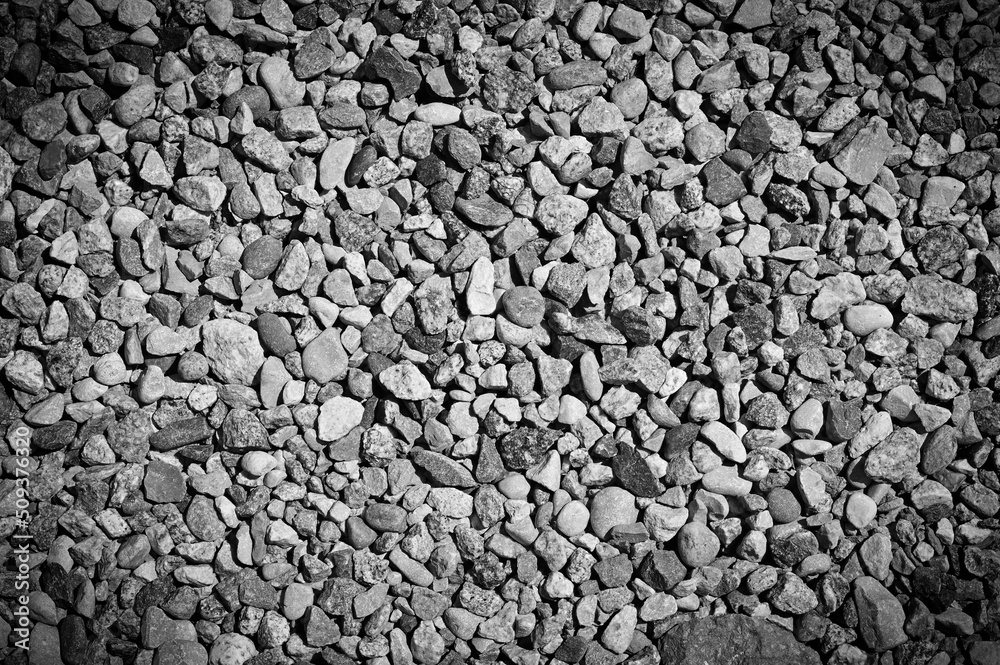 Smooth background with a pebble texture. Pebble sea beach close-up, gray dry pebbles. Smooth background with a pebble texture. Pebble sea beach close-up, gray dry pebbles.