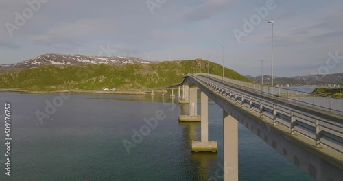 Wallpaper Mural Aerial drone flies along Sommaroya Island Bridge. Seagulls fly past, Northern Norway. Windmills in the background. Torontodigital.ca