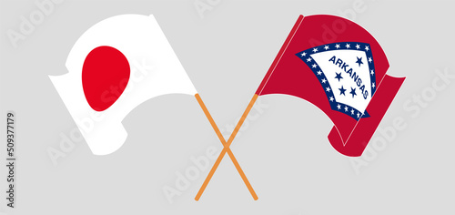 Crossed and waving flags of Japan and The State of Arkansas