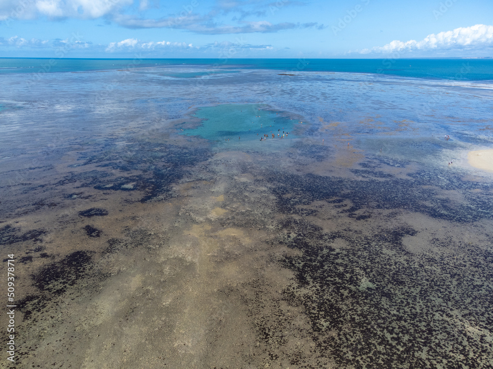 Obraz premium Amazing coral reef in the middle of the sea in Porto Seguro, Bahia, Brazil - natural beauty aerial drone view