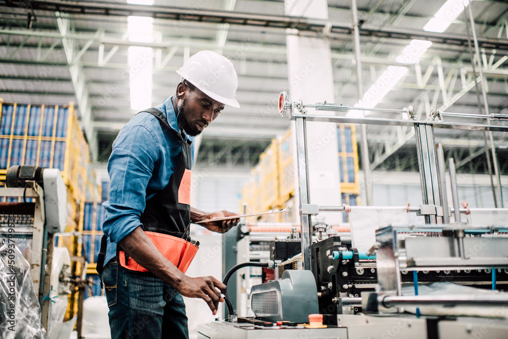 Technician working in factory check functionality while commissioning a production line, Man working Technician working in factory check functionality while commissioning a production line, Man working