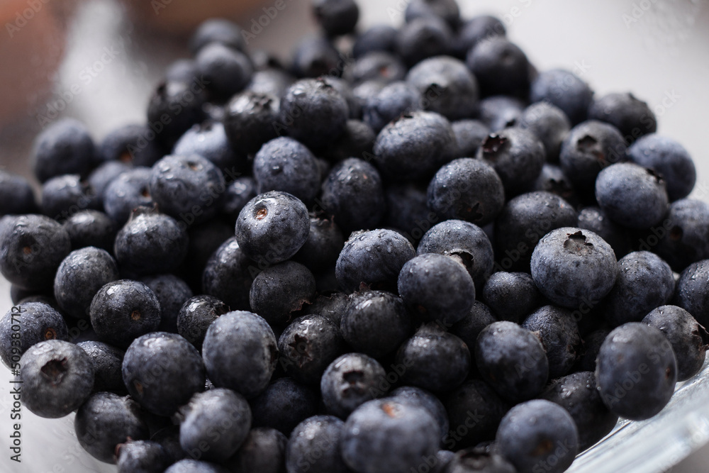 Fresh blueberries in glass bowl on kitchen counter, healthy food for diet. Fresh blueberries in glass bowl on kitchen counter, healthy food for diet.