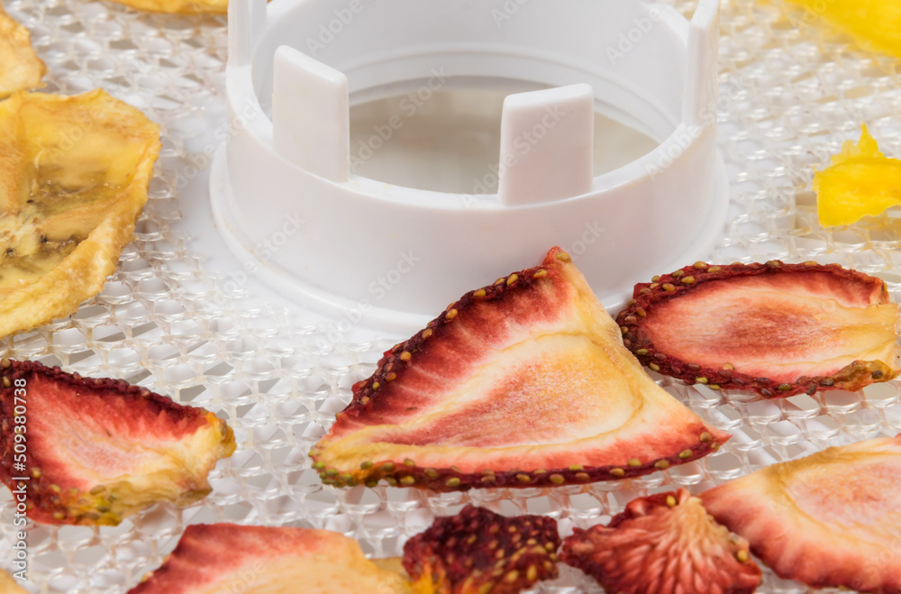dried strawberry pieces on a white lattice, close-up dried strawberry pieces on a white lattice, close-up