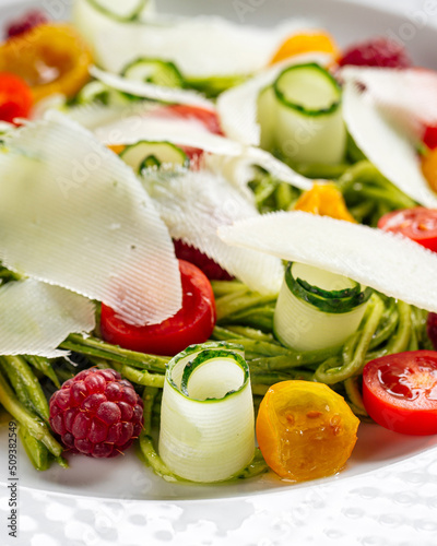 Plate of gourmet fresh vegetable salad on served table