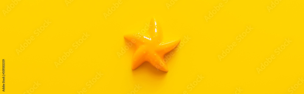 top view of bright starfish toy on yellow background, banner. - obrazy, fototapety, plakaty 