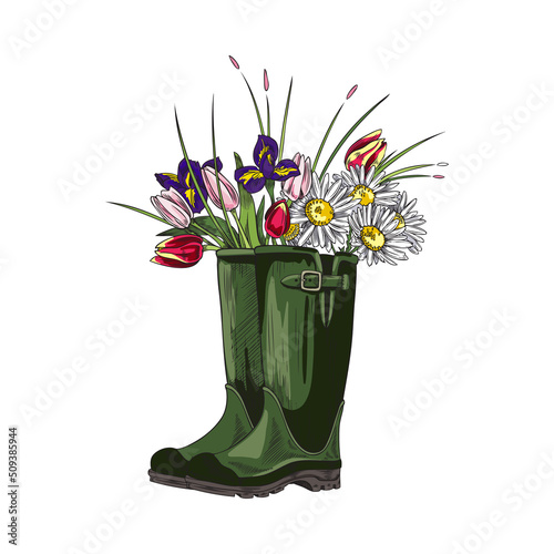 Green rubber welly boots with bouquet of tulips, chamomiles and other flowers inside