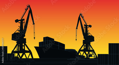 Silhouette commercial cargo port with cranes and container ship at the pier on background with sunset sky.
