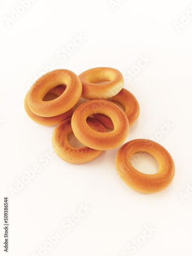 crispy bread rings on white background