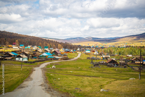 Panorama of valley with village in Altai mountains of the Katun River valley in South of Western Siberia, Russia.