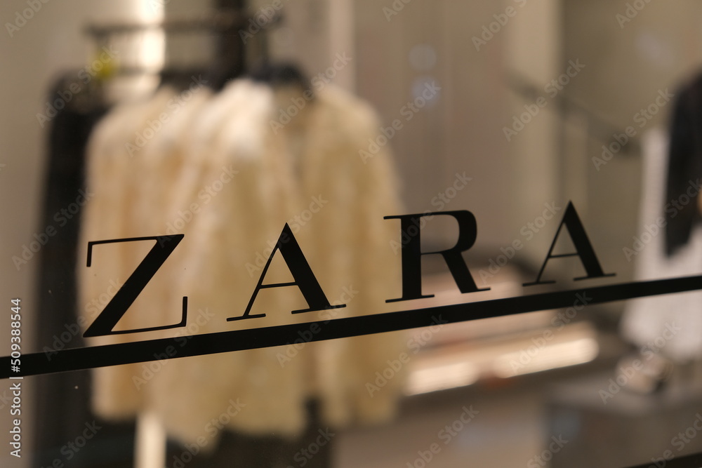 Shanghai,China-June 5th 2022: close up ZARA brand logo on store glass. Blur  clothing in store Stock Photo | Adobe Stock