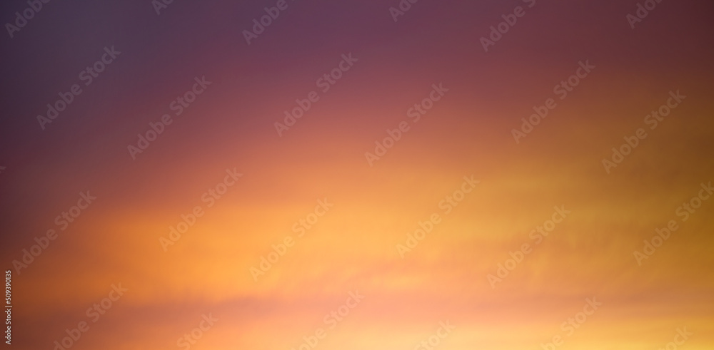 Bright orange sky at sunset, low key. Warm tones.