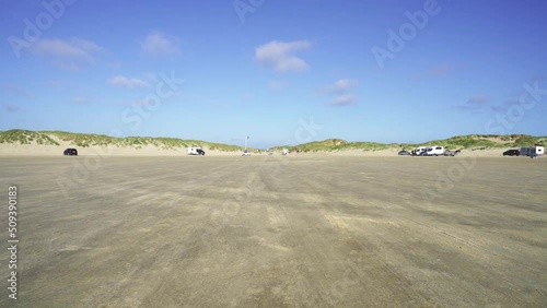 Timelapse of cars arriving and driving away at the beach of Rømø in Denmark