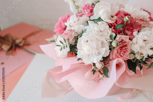 Bouquet of peonies and balloons, greeting card with the holiday. Birthday, Valentine's day, March 8.