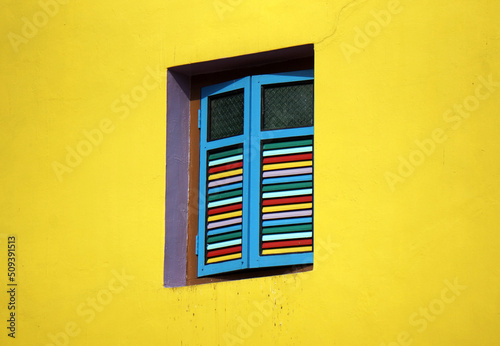 Beautiful classic painted wooden windows in Little India in Singapore.