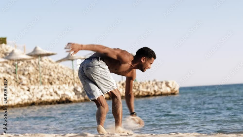 Handsome black young man topless dancing break dance, jumping