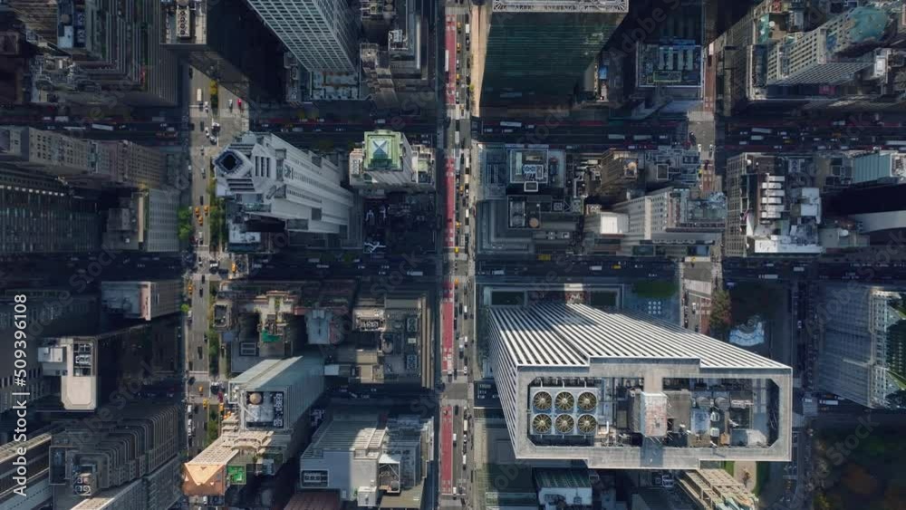 Aerial birds eye overhead top down view of city. Fly over high rise downtown buildings. Traffic in streets between. Manhattan, New York City, USA