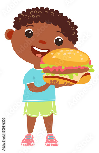 Tasty fast food for children. Smiling boy with burger