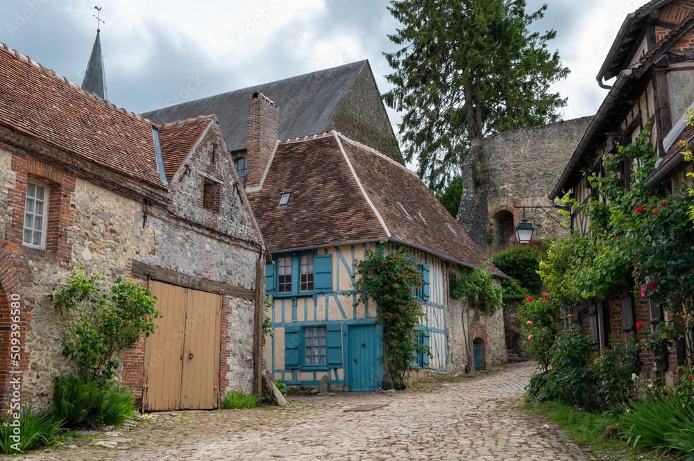 One of most beautiful french villages, Gerberoy - small historical village with half-timbered houses and colorful roses flowers, France One of most beautiful french villages, Gerberoy - small historical village with half-timbered houses and colorful roses flowers, France
