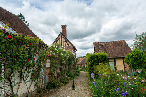 One of most beautiful french villages, Gerberoy - small historical village with half-timbered houses and colorful roses flowers, France photo