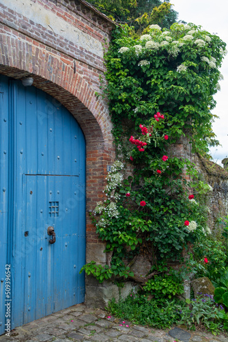 One of most beautiful french villages, Gerberoy - small historical village with half-timbered houses and colorful roses flowers, France © barmalini