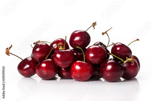 fresh organic cherries isolated on white background