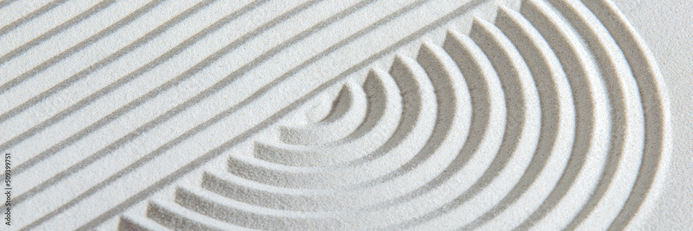 Japanese garden with yin yang stone in textured sand Japanese garden with yin yang stone in textured sand