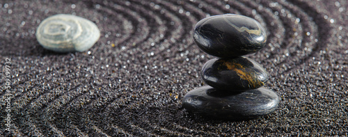 Canvas Print Japanese garden with yin yang stone in textured sand