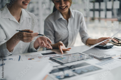 Asian business adviser meeting to analyze and discuss the situation on the financial report in the meeting room.Investment Consultant, Financial advisor and accounting concept.