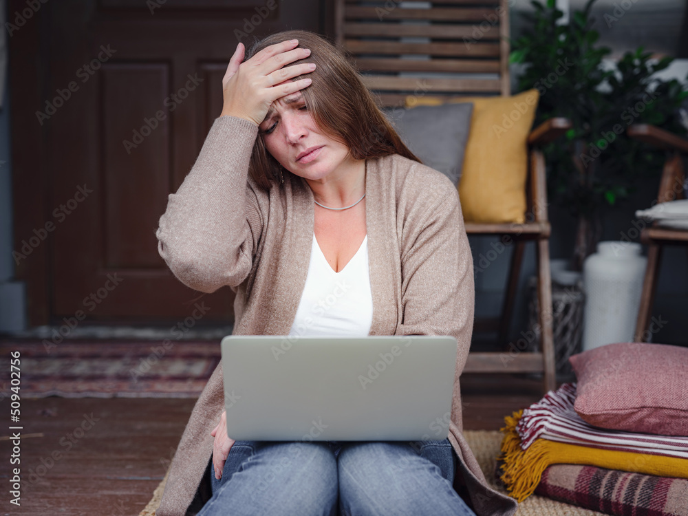 Stressed forgetful old middle aged woman suffering from headache after computer work. Tired upset lady feeling stress, fatigue or migraine using laptop at home office. Stressed forgetful old middle aged woman suffering from headache after computer work. Tired upset lady feeling stress, fatigue or migraine using laptop at home office.