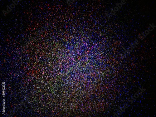 Fotografia abstract glowing grains in purple, orange, red and blue on a dark background