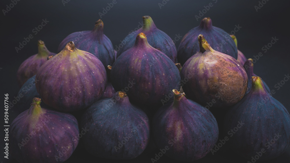 Tasty figs on a black background. Top view. Tasty figs on a black background. Top view.