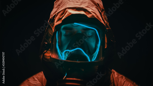  Man with suit and gas mask at night  photo