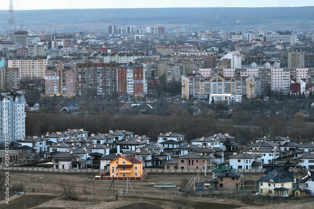 Aerial view of residential houses in suburban rural area of big city