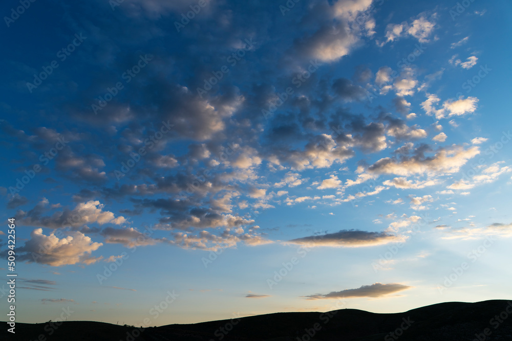 Beautiful sunrise sky clouds and hill silhouette. Sunrise background.