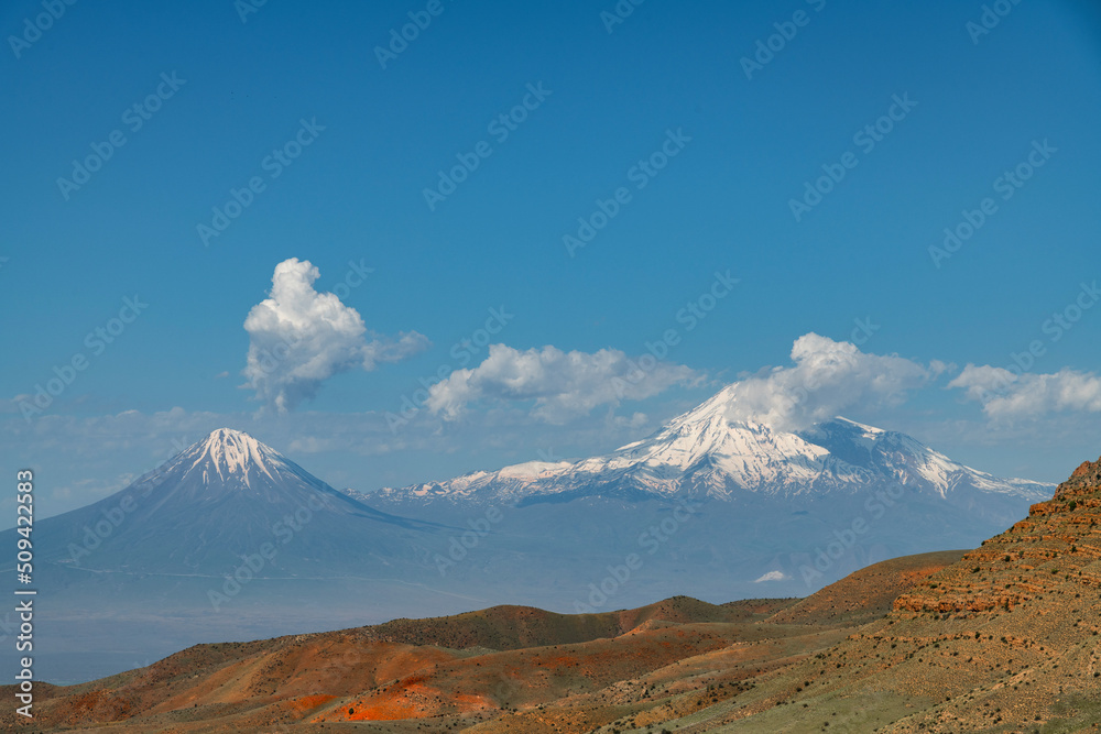 Beautiful view of the Ararat mountains and clouds sky.