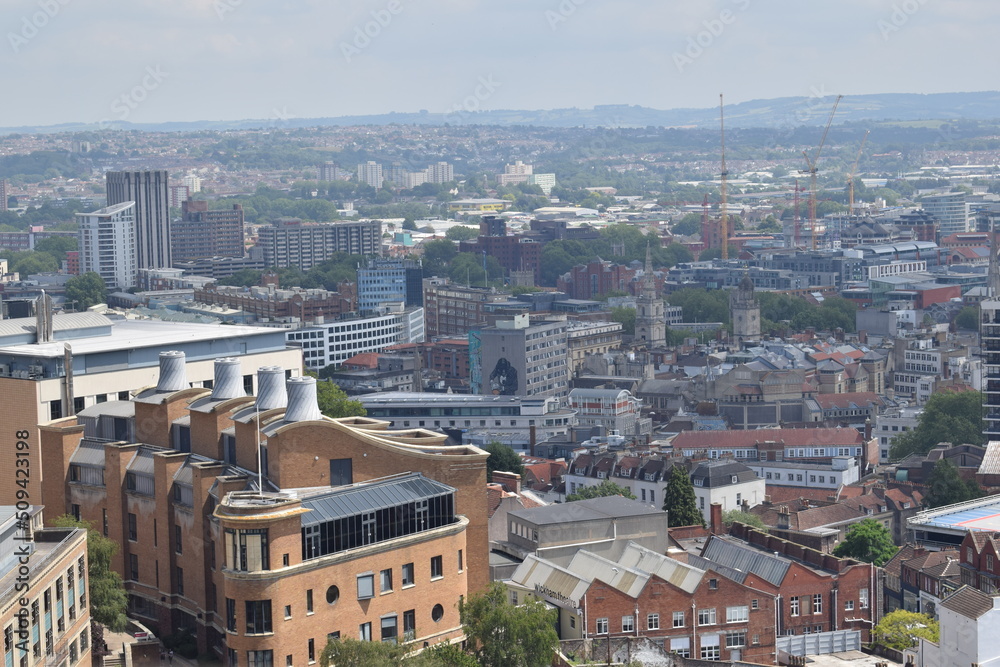 Aerial view of Bristol city during sunny day with sky and clouds.